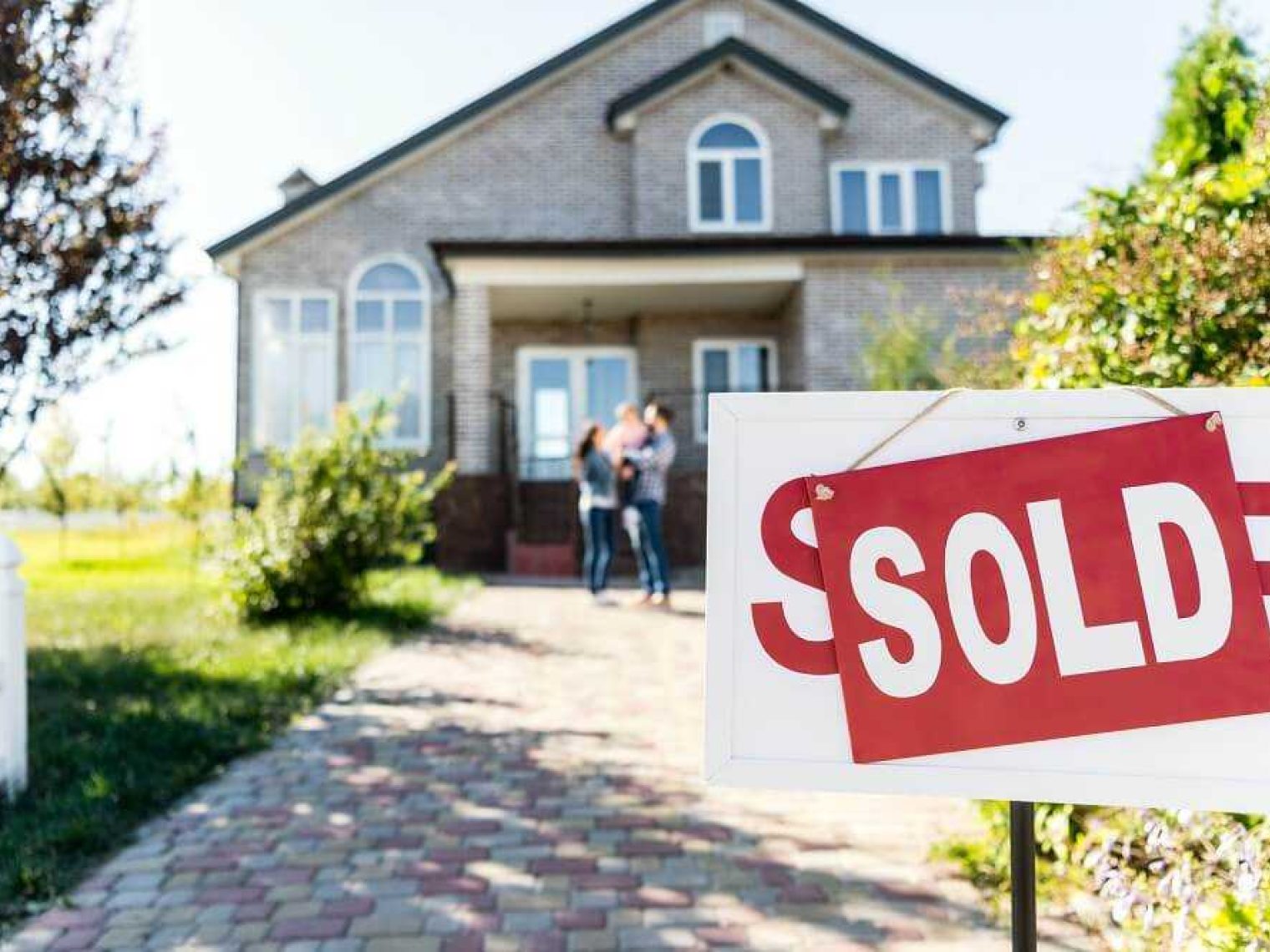 Sold sign in front of a home.