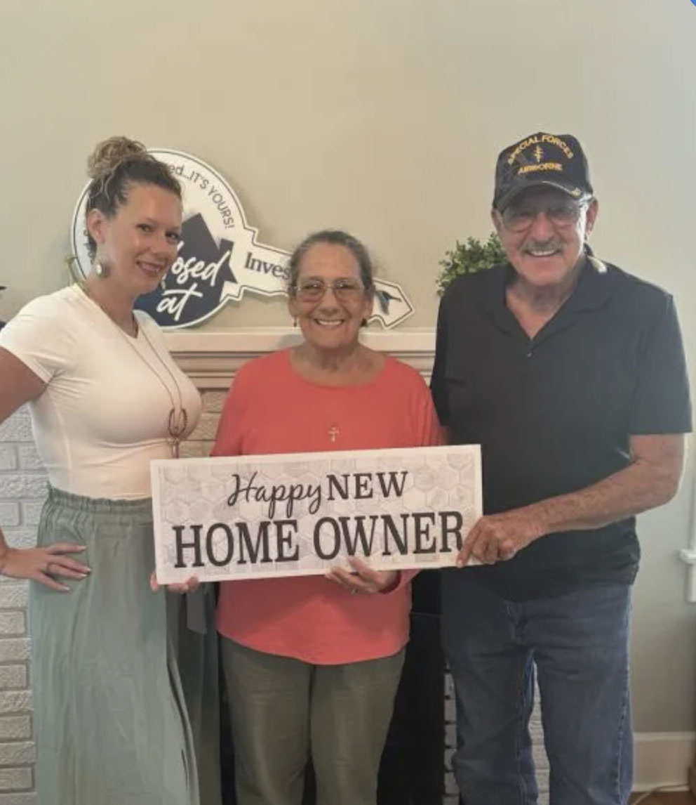picture of Dennis M. in front of a house