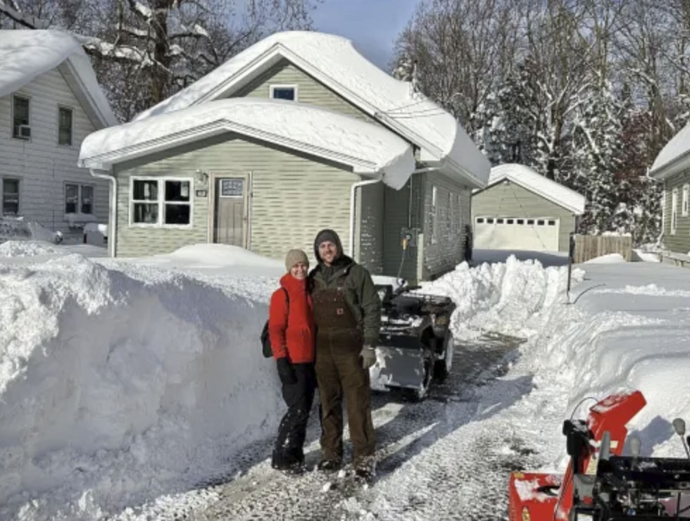 picture of Nathan K. in front of a house
